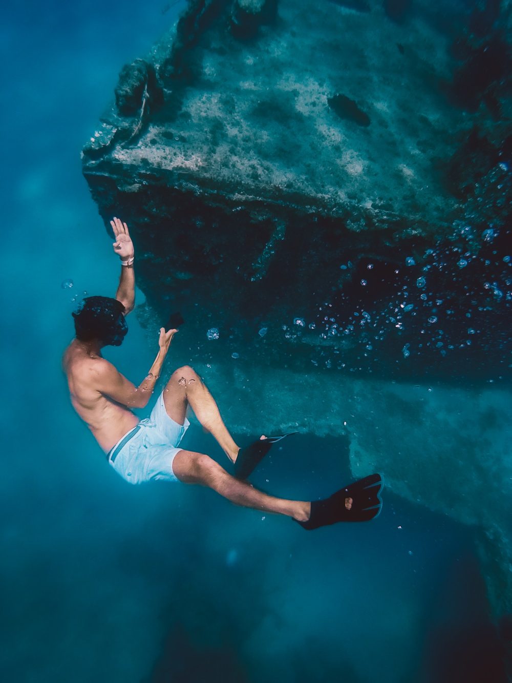 boy-snorkels-next-to-a-ship-wreck-submerged-in-the-ocean.jpg boy-snorkels-next-to-a-ship-wreck-submerged-in-the-ocean.jpg